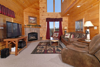 Pigeon Forge Cabin Living Room Area with a Gas Fireplace and Flat Screen TV